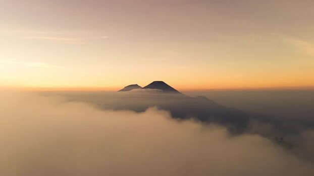 Aerial view of Gunung Prau above clouds in Indonesia.