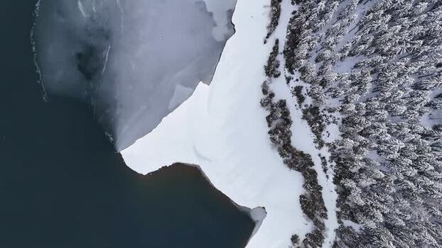Aerial view of frozen Soboth Reservoir in Styria Austria.