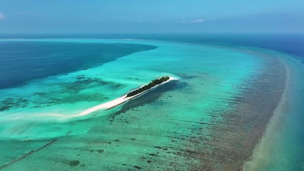 Aerial view of a tropical island with white sand and turquoise water Maldives. Aerial view of a tropical island with white sand and turquoise water Maldives.
