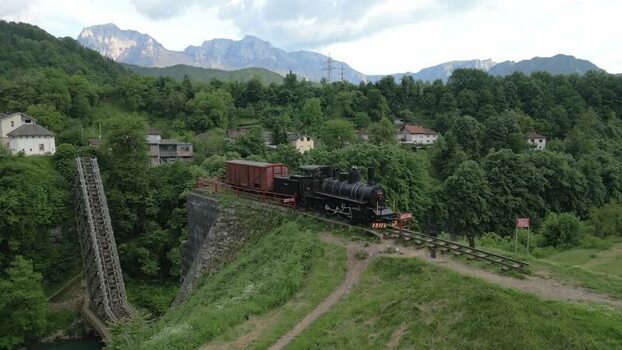 Aerial view of a steam train on a bridge in Bosnia and Herzegovina. Aerial view of a steam train on a bridge in Bosnia and Herzegovina.