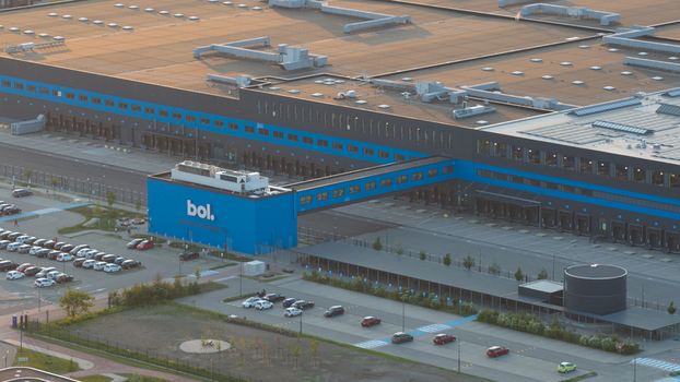 Waalwijk Netherlands 09 May 2026 Aerial view of the Bol. distribution center featuring its large blue facade loading docks and parking area during sunset. Waalwijk Netherlands 09 May 2026 Aerial view of the Bol. distribution center featuring its large blue facade loading docks and parking area during sunset.