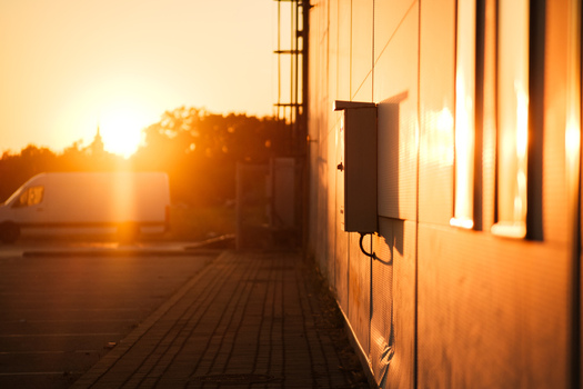 View of a building wall with an electrical box during a warm sunset in Sremska Mitrovica Vojvodina Serbia.