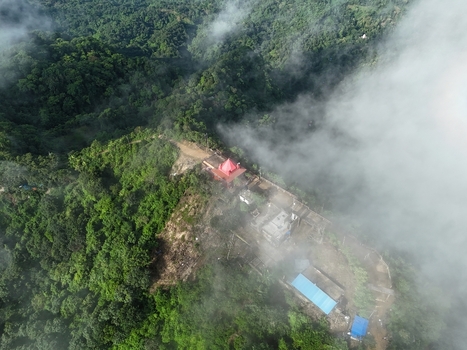 Aerial view of Chandranath Temple on a lush green hilltop surrounded by dense forest and clouds in Sitakund Chittagong Division Bangladesh. Aerial view of Chandranath Temple on a lush green hilltop surrounded by dense forest and clouds in Sitakund Chittagong Division Bangladesh.