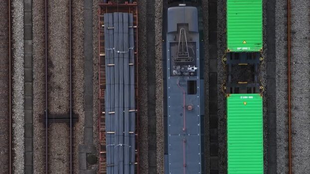 Aerial view of train cars with shipping containers Portugal.