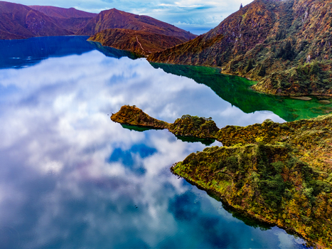 Ribeira Grande Portugal 12 May 2025 Aerial view of Lagoa do Fogo crater lake with clouds reflecting in the turquoise water and lush volcanic hills in the Azores. Ribeira Grande Portugal 12 May 2025 Aerial view of Lagoa do Fogo crater lake with clouds reflecting in the turquoise water and lush volcanic hills in the Azores.