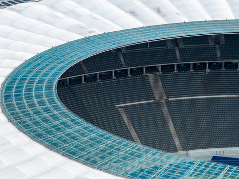 Berlin Berlin Germany 26 September 2026 Aerial view of the Olympiastadion Berlin showing the distinctive curved glass roof structure and the empty stadium seating.