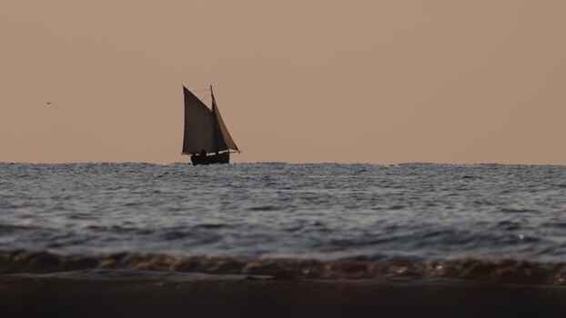 View of a sailboat and another boat on the sea France. View of a sailboat and another boat on the sea France.