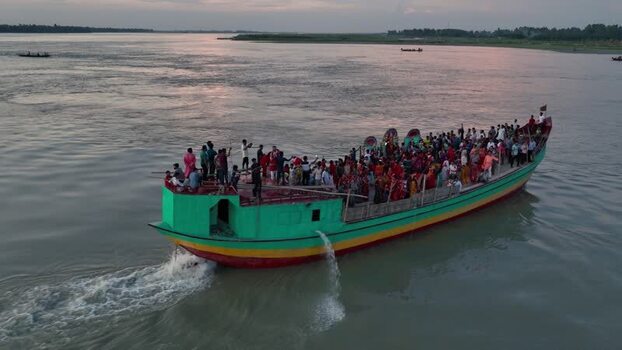 Aerial view of a crowded passenger boat on the river Bangladesh.