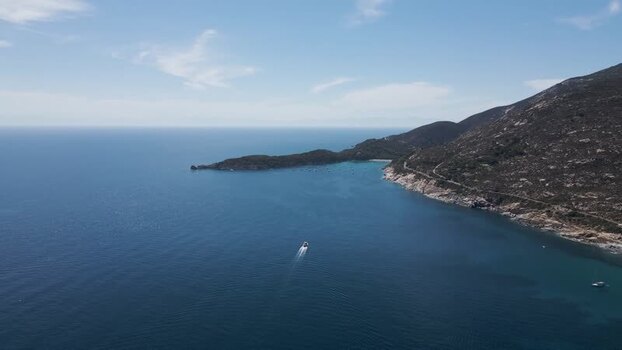 Aerial View of a boat sailing along the coast Elba Island Tuscany Italy.