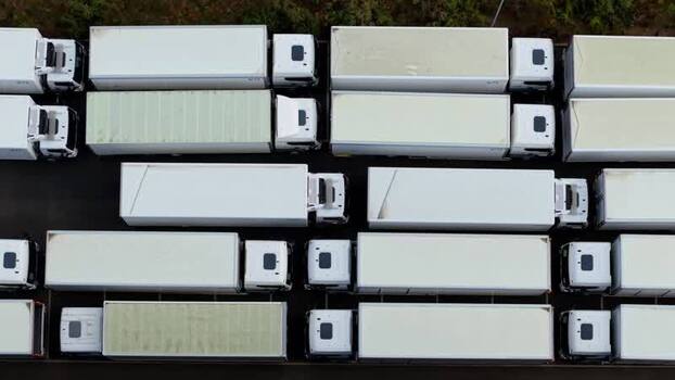 Aerial view of semi trucks on a highway in United Kingdom.