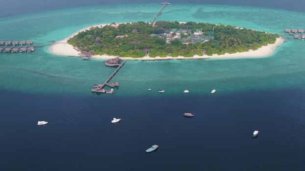 Aerial view of a tropical island and turquoise waters Maldives. Aerial view of a tropical island and turquoise waters Maldives.