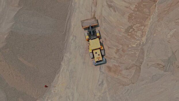 Aerial view of a bulldozer in a quarry Indonesia.