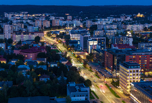 Aerial view of the illuminated cityscape of Vilnius at night featuring buildings busy streets with traffic lights and a dense urban landscape in Vilnius Vilnius County Lithuania. Aerial view of the illuminated cityscape of Vilnius at night featuring buildings busy streets with traffic lights and a dense urban landscape in Vilnius Vilnius County Lithuania.
