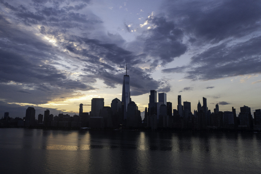 Aerial view of the New York Skyline at sunset with dramatic clouds over the Hudson River in New York New York United States.