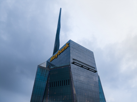 Kuala Lumpur Malaysia 09 March 2026 Aerial view of Menara Maybank skyscraper with its distinctive spire and glass facade under a cloudy sky.