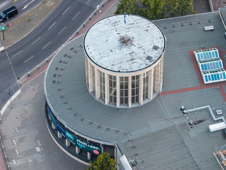 Aerial view of the Messe Berlin exhibition center featuring its distinctive circular rotunda and flat roof in Berlin Berlin Germany. Aerial view of the Messe Berlin exhibition center featuring its distinctive circular rotunda and flat roof in Berlin Berlin Germany.