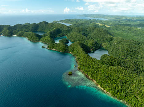 Aerial view of Bucas Grande featuring lush green islands hidden lagoons and turquoise waters surrounded by coral reefs in Siargao Philippines. Aerial view of Bucas Grande featuring lush green islands hidden lagoons and turquoise waters surrounded by coral reefs in Siargao Philippines.