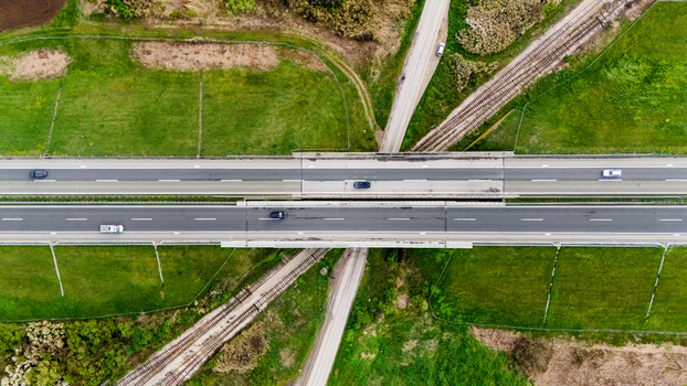 Aerial view of a highway cutting through vibrant green fields a stark contrast between nature and infrastructure Sremska Mitrovica Vojvodina Serbia. Aerial view of a highway cutting through vibrant green fields a stark contrast between nature and infrastructure Sremska Mitrovica Vojvodina Serbia.