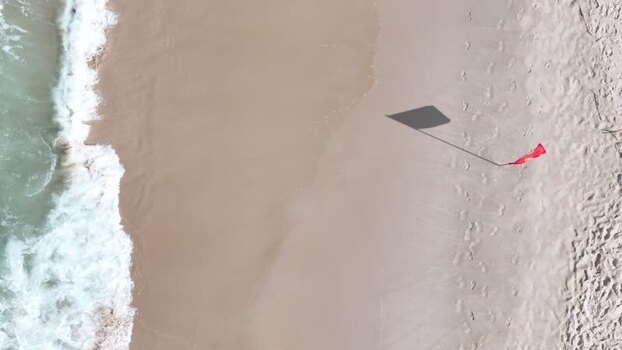 Aerial view of a red flag on Copacabana Beach Brazil.