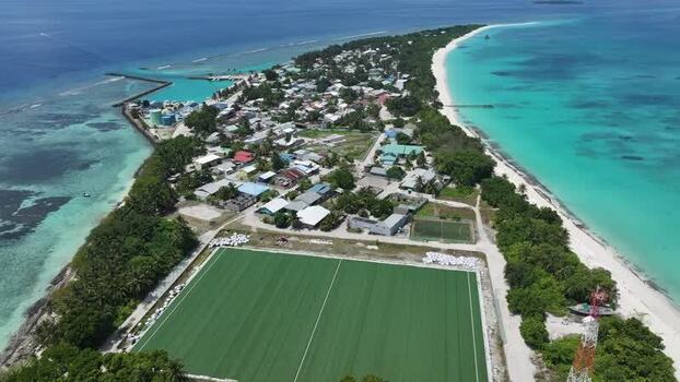 Aerial view of Vashafaru island with its turquoise lagoon Maldives. Aerial view of Vashafaru island with its turquoise lagoon Maldives.
