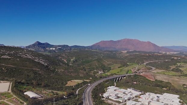 Aerial view of a stone quarry and asphalt plant in Manilva Spain. Aerial view of a stone quarry and asphalt plant in Manilva Spain.