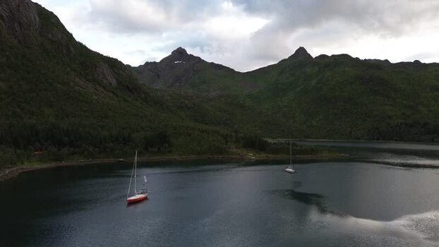 Aerial view of sailboats in a fjord in Senja Norway. Aerial view of sailboats in a fjord in Senja Norway.