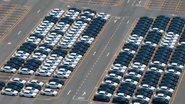 Aerial view of rows of new cars parked in a large logistics lot at the BYD Thailand Rayong Office Building in Phananikhom Rayong Thailand. Aerial view of rows of new cars parked in a large logistics lot at the BYD Thailand Rayong Office Building in Phananikhom Rayong Thailand.