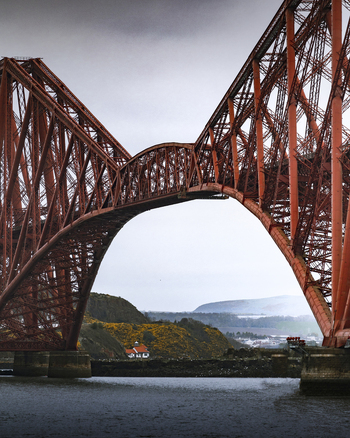 View of the majestic bridge spanning the river with a scenic landscape South Queensferry Great Britain.