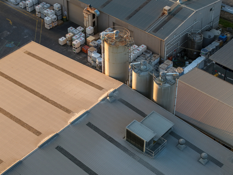 Melbourne Australia 22 September 2026 Aerial view of industrial factories in Kilsyth featuring large storage silos metal rooftops and numerous plastic containers. Melbourne Australia 22 September 2026 Aerial view of industrial factories in Kilsyth featuring large storage silos metal rooftops and numerous plastic containers.
