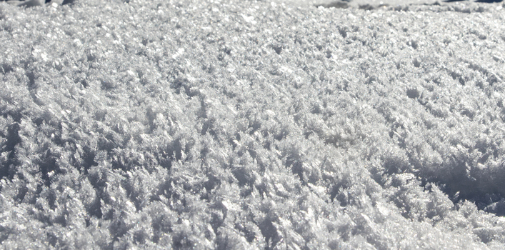 View of crystalline snow and frost patterns covering the ground in Arang Kel Kashmir Pakistan. View of crystalline snow and frost patterns covering the ground in Arang Kel Kashmir Pakistan.
