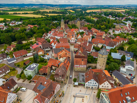 Aerial view of the historic town of Neuenstein featuring the medieval castle traditional half timbered houses and red tiled rooftops in Neuenstein Baden Wurttemberg Germany. Aerial view of the historic town of Neuenstein featuring the medieval castle traditional half timbered houses and red tiled rooftops in Neuenstein Baden Wurttemberg Germany.