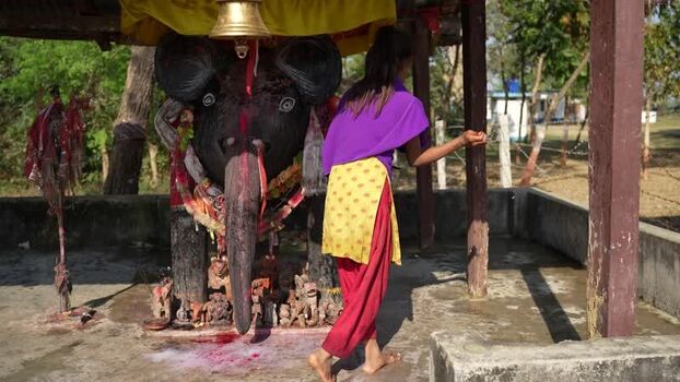 View of a woman at a religious shrine in Dang Nepal.