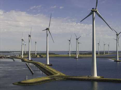 Aerial view of the Grevelingendam wind farm with rows of wind turbines standing in the water along the dam in Bruinisse Zeeland Netherlands. Aerial view of the Grevelingendam wind farm with rows of wind turbines standing in the water along the dam in Bruinisse Zeeland Netherlands.