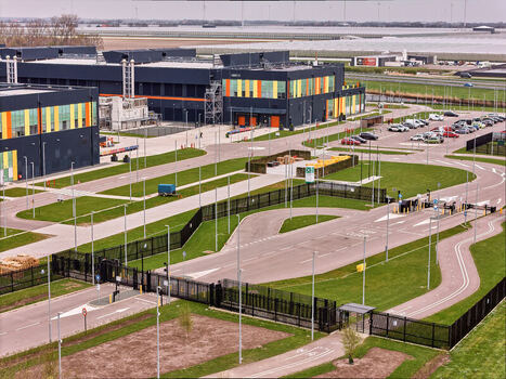 Middenmeer Netherlands 15 April 2026 Aerial view of Microsoft Datacenter Campus AMS 13 and 14 featuring modern dark buildings with colorful accents and secure entrance gates. Middenmeer Netherlands 15 April 2026 Aerial view of Microsoft Datacenter Campus AMS 13 and 14 featuring modern dark buildings with colorful accents and secure entrance gates.