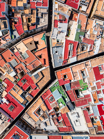 Aerial view of dense urban rooftops with red tiles and narrow streets in Andalusia Spain. Aerial view of dense urban rooftops with red tiles and narrow streets in Andalusia Spain.