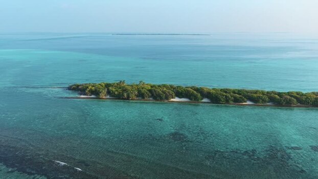 Aerial view of a tropical island and turquoise sea Maldives. Aerial view of a tropical island and turquoise sea Maldives.