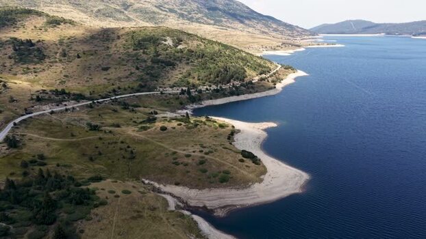 Aerial view of Belmeken Dam and winding road in Bulgaria. Aerial view of Belmeken Dam and winding road in Bulgaria.