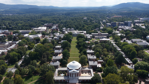 Aerial view of the Rotunda at the University of Virginia surrounded by historic academic buildings lush green lawns and mature trees in Charlottesville Virginia United States. Aerial view of the Rotunda at the University of Virginia surrounded by historic academic buildings lush green lawns and mature trees in Charlottesville Virginia United States.