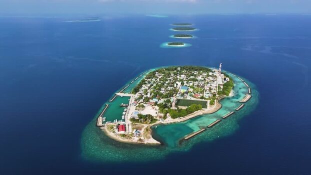 Aerial view of Kendhoo island and coral reefs Maldives. Aerial view of Kendhoo island and coral reefs Maldives.