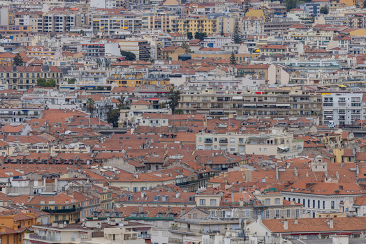 Aerial view of the dense urban landscape featuring terracotta rooftops and historic buildings in Nice Provence Alpes Cote d Azur France. Aerial view of the dense urban landscape featuring terracotta rooftops and historic buildings in Nice Provence Alpes Cote d Azur France.