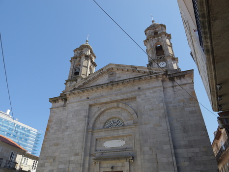 View of the Concatedral Basilica de Santa Maria de Vigo with its stone facade and twin bell towers under a clear blue sky in Vigo Pontevedra Spain. View of the Concatedral Basilica de Santa Maria de Vigo with its stone facade and twin bell towers under a clear blue sky in Vigo Pontevedra Spain.