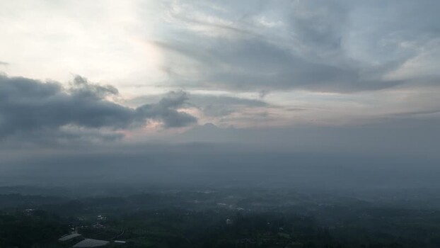 Aerial view of misty mountains and lush landscape Indonesia. Aerial view of misty mountains and lush landscape Indonesia.