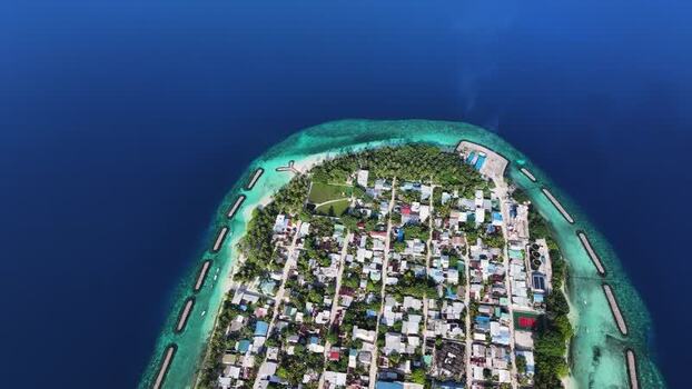 Aerial view of Kendhoo island and its turquoise coral reef Maldives. Aerial view of Kendhoo island and its turquoise coral reef Maldives.