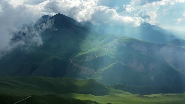Aerial view of Caucasus Mountains with winding road Russia.