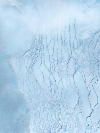 Aerial view of the intricate blue mineral formations and geothermal textures of the Reykjanes landscape in Grindavikurbaer Iceland. Aerial view of the intricate blue mineral formations and geothermal textures of the Reykjanes landscape in Grindavikurbaer Iceland.