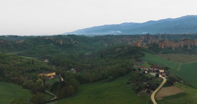 Aerial view of the Balze del Valdarno rock formations and green hills Italy. Aerial view of the Balze del Valdarno rock formations and green hills Italy.