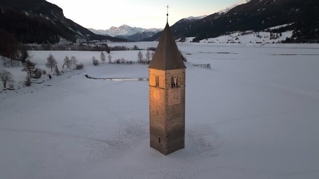 Aerial view of the sunken bell tower in Graun im Vinschgau Italy. Aerial view of the sunken bell tower in Graun im Vinschgau Italy.