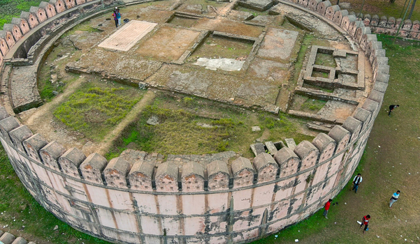 Aerial view of the ancient circular fort with its weathered walls and geometric interior ruins stands as a testament to time Munshiganj Dhaka Division Bangladesh. Aerial view of the ancient circular fort with its weathered walls and geometric interior ruins stands as a testament to time Munshiganj Dhaka Division Bangladesh.