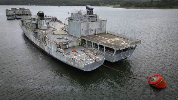 Aerial view of the mothballed warships creating a stark contrast between their aged metal and the serene reflective waters Landévennec France. Aerial view of the mothballed warships creating a stark contrast between their aged metal and the serene reflective waters Landévennec France.