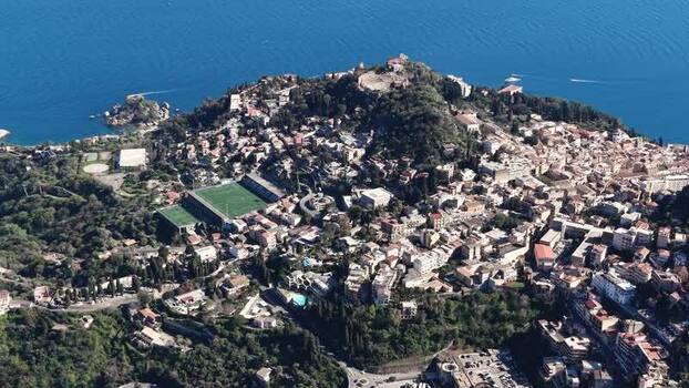 Aerial view of Taormina and the Ancient Greek Theatre Italy.